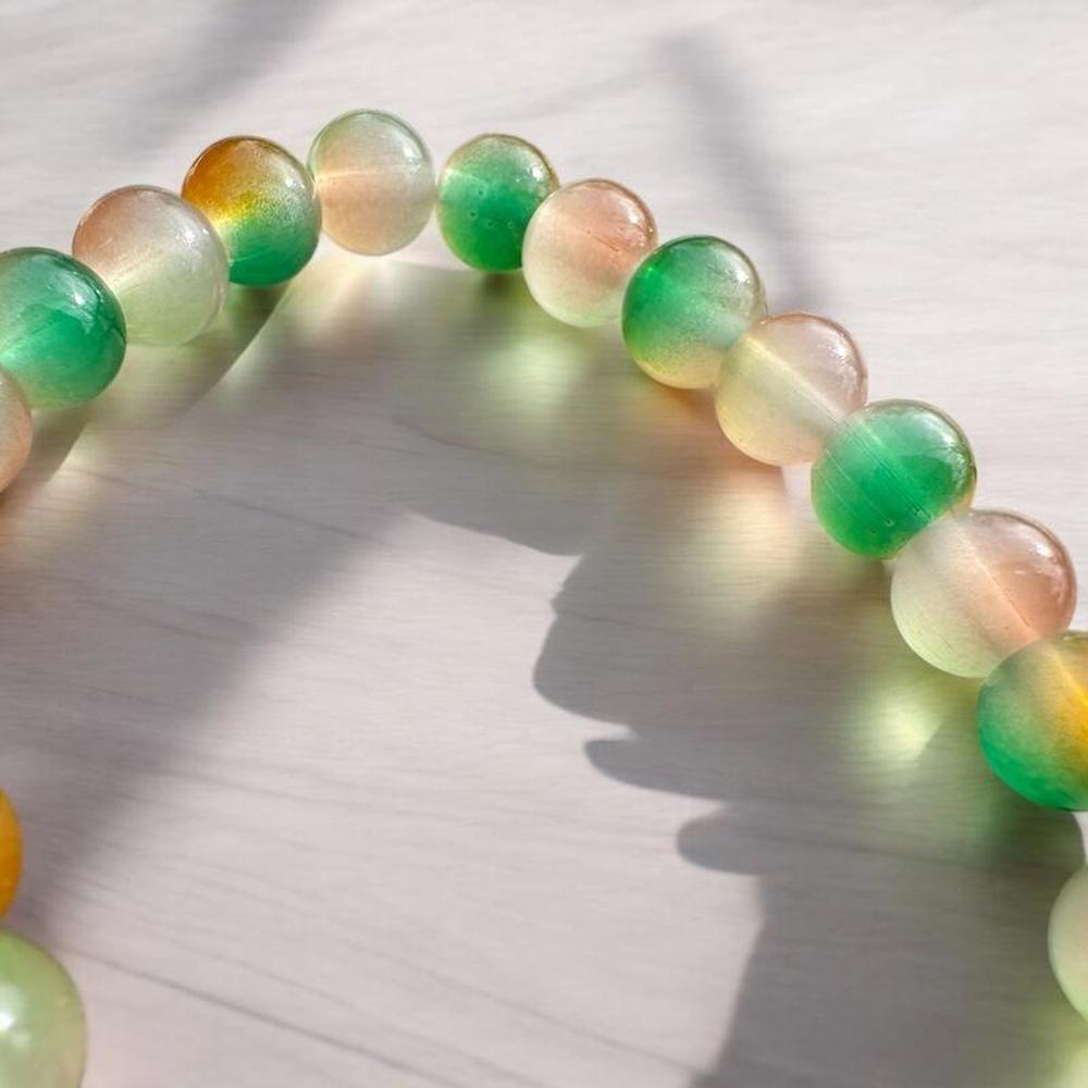 Beaded Bracelet with Green Tassel Charm