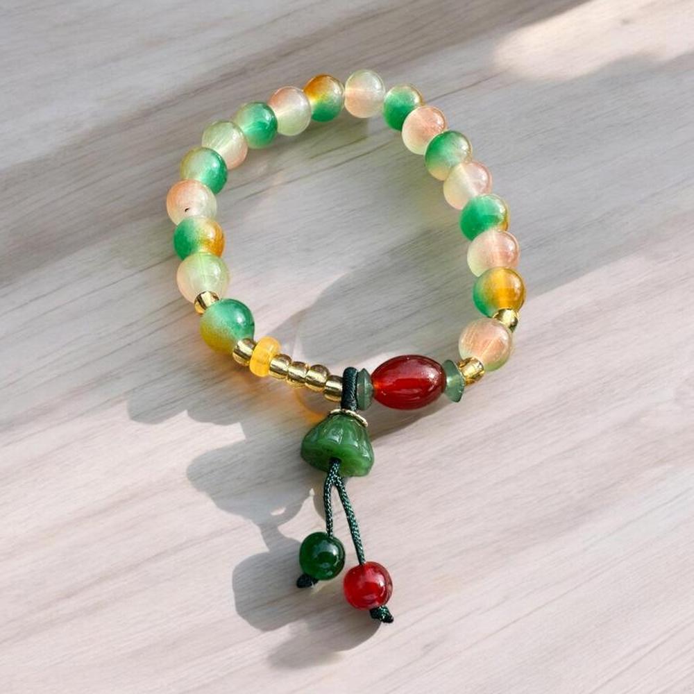 Beaded Bracelet with Green Tassel Charm