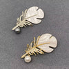 Rhinestone Feather Brooch: Silver