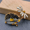 Hedgehog Under Enameled Daisies Brooch