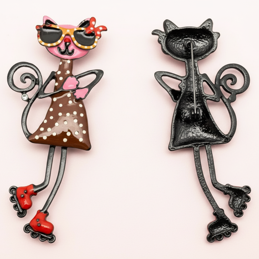 Front and backside of decorative brooch of a cat character with sunglasses and roller skates on a light gray background