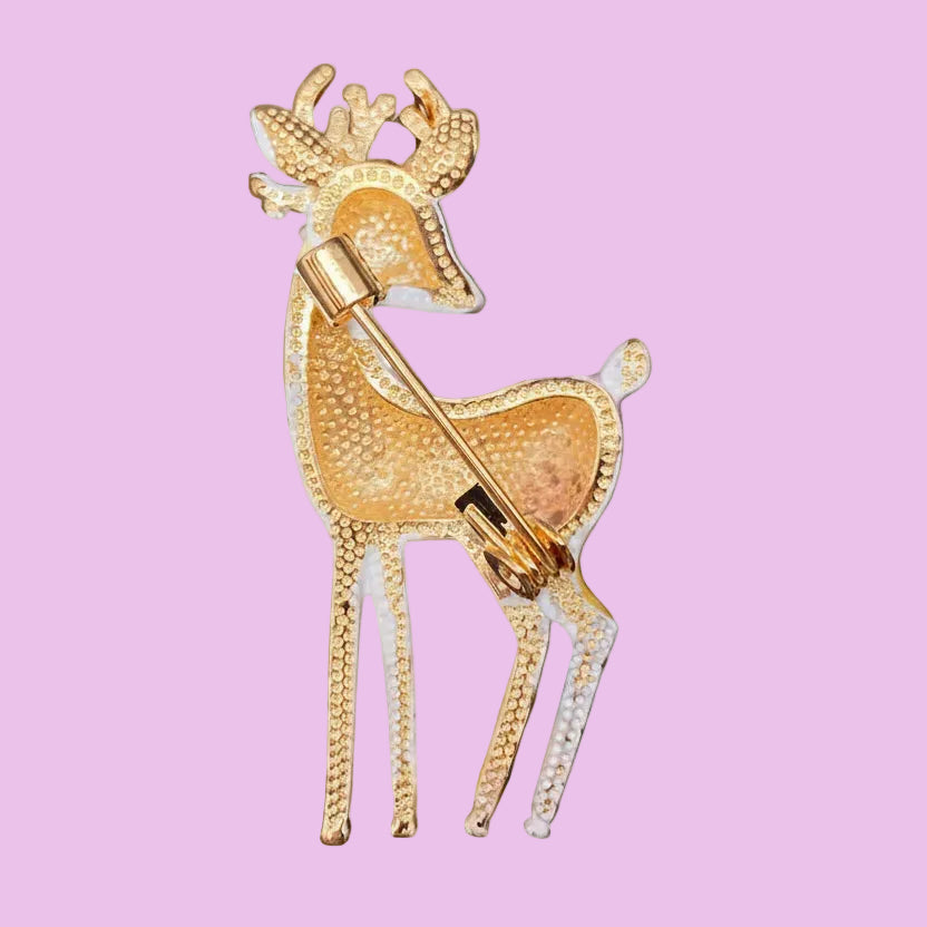 Backside of enamel deer brooch on a soft white background