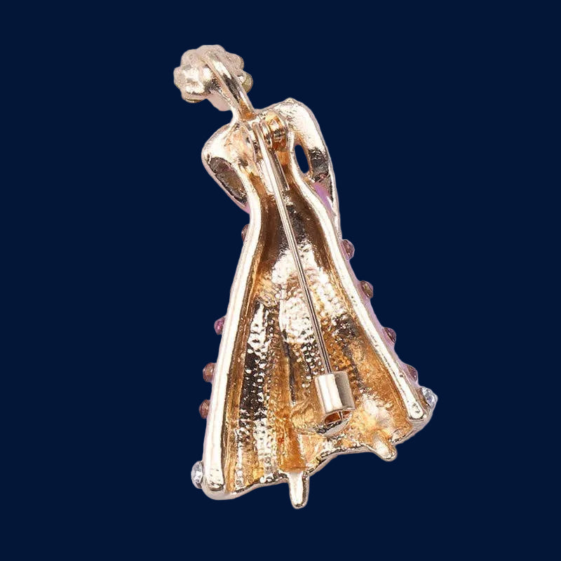 Backside of lavender dancing lady brooch with purple accents on a navy background