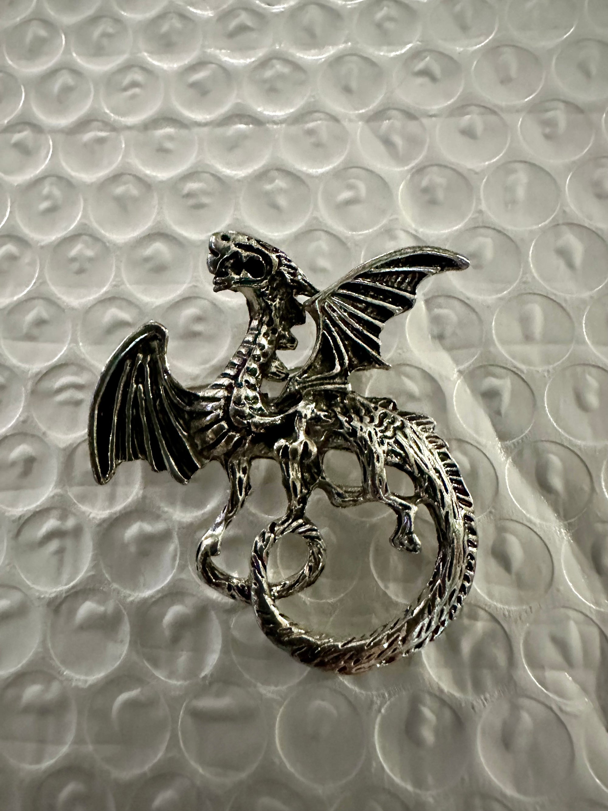 Carved Dragon Brooches
