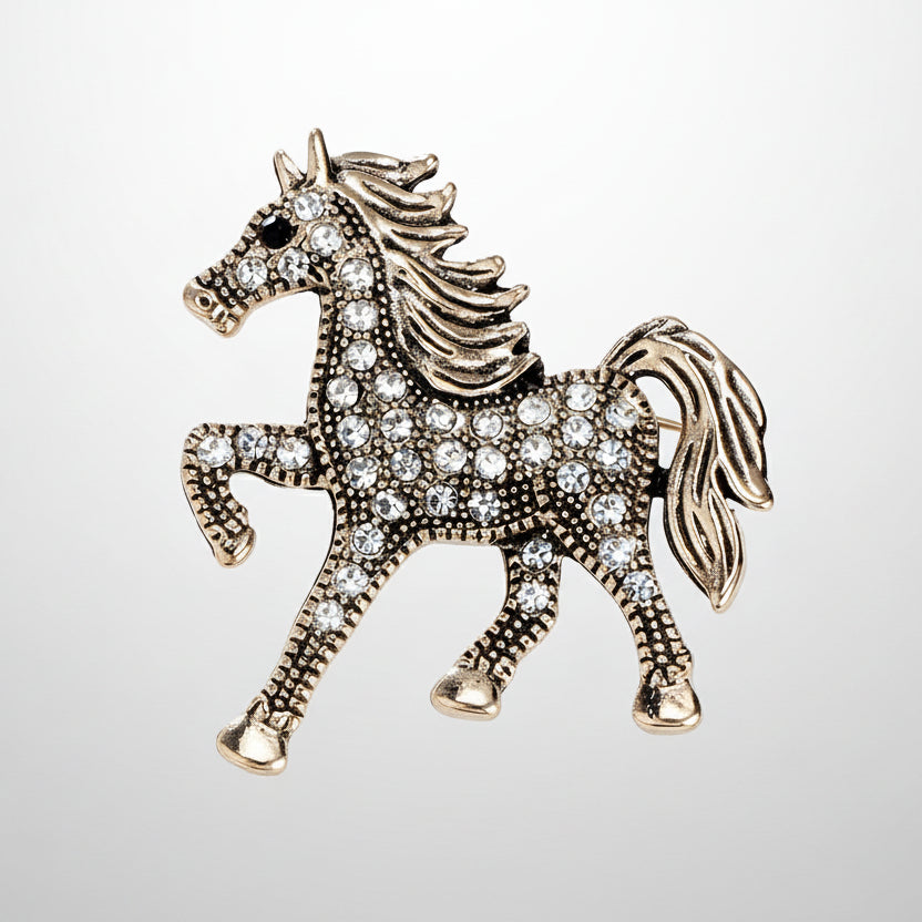 Decorative horse brooch with rhinestones on a light gray background