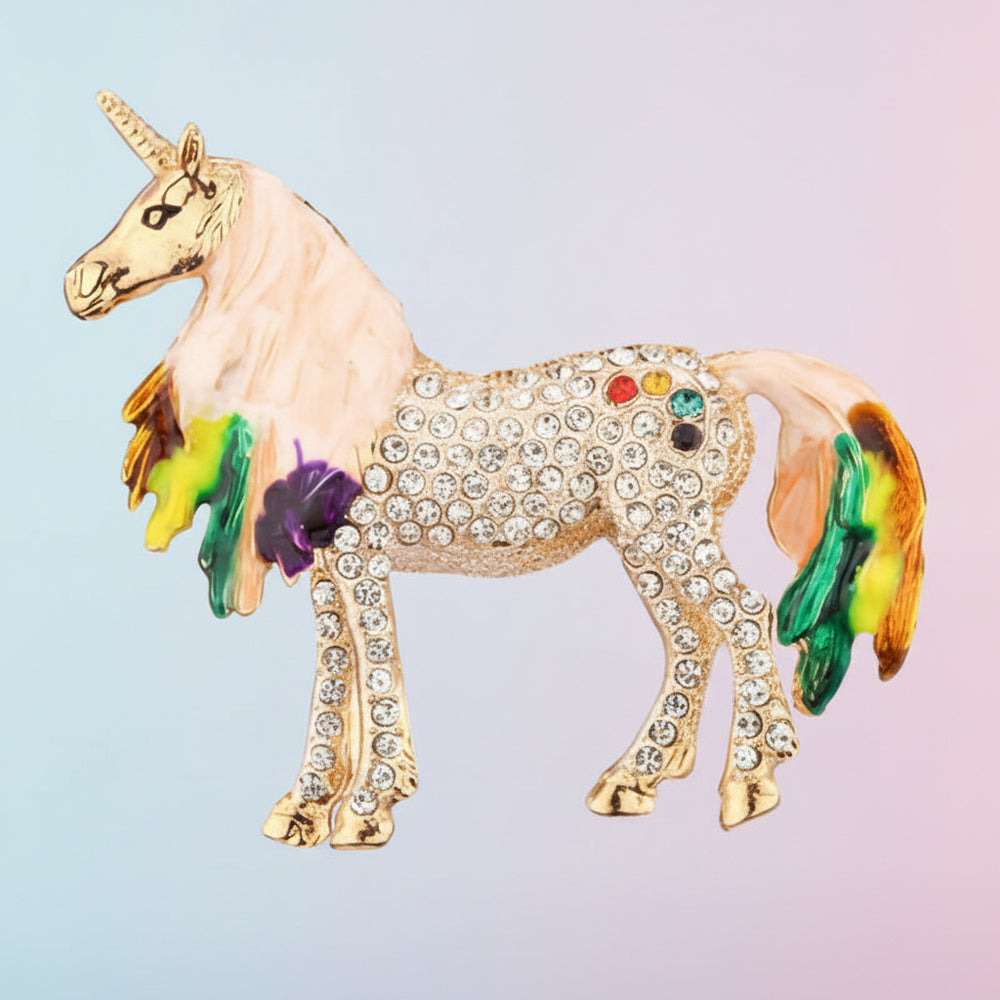 Unicorn brooch with rainbow-colored mane and tail on a light blue background