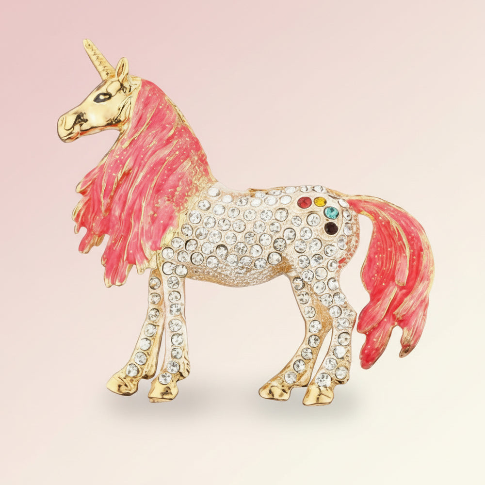 Unicorn brooch with pink mane and tail and rainbow-colored accents on body on a soft pastel background