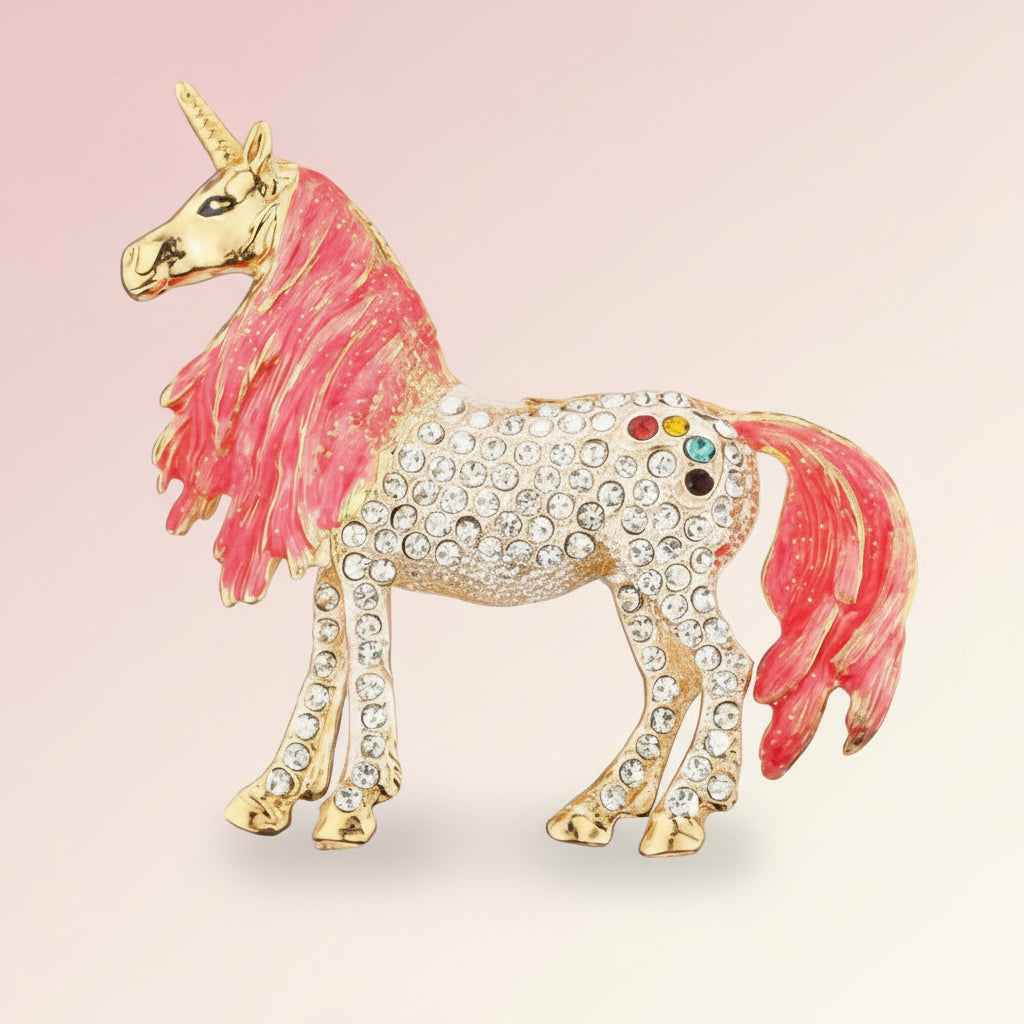 Unicorn brooch with pink mane and tail and rainbow-colored accents on body on a soft pastel background