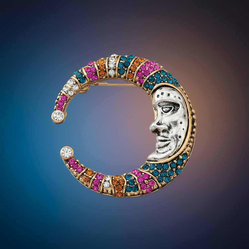 Fantasy moon brooch with colorful gemstones on a gradient background