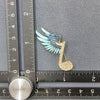 Winged Rhinestone Musical Note Brooch